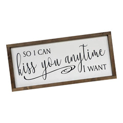 Soft white background with matte black lettering sign