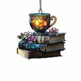 Floral book and tea cup acrylic ornament on display