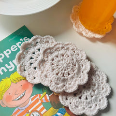 Flower shaped coaster with scalloped edge openwork design