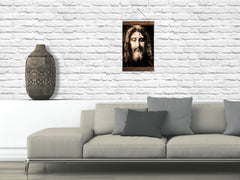 Framed Catholic wall art featuring Jesus face