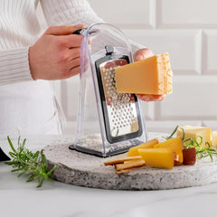 Compact plastic grater sized about 5in×4in×8in for kitchen prep