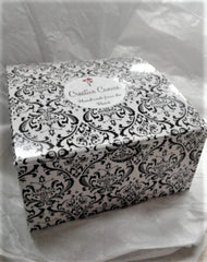 Optional silver-tone feather wing charm for ornament