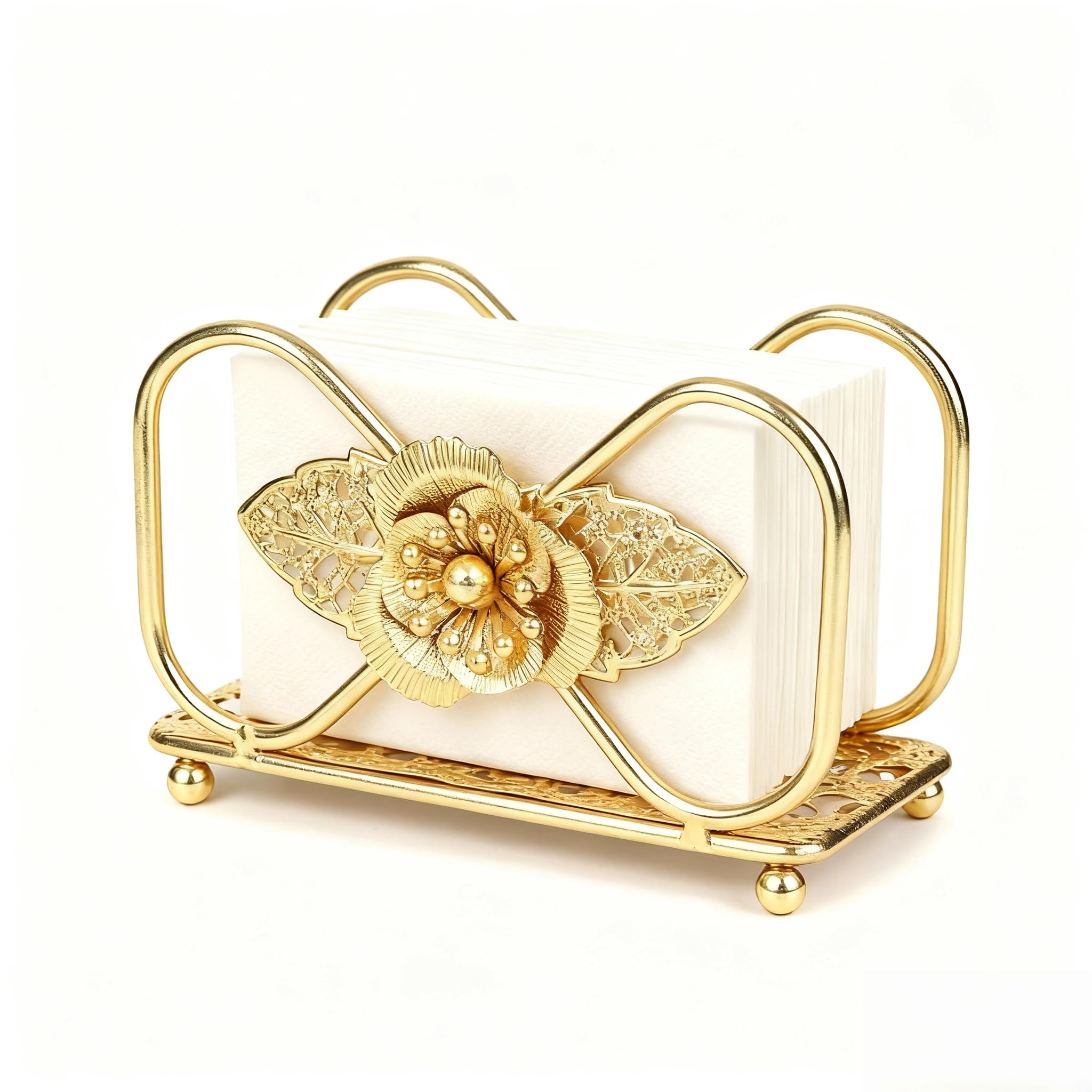 Gold napkin holder on table with floral pattern