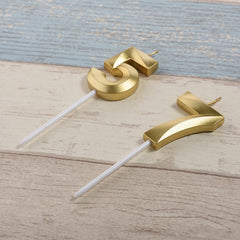 Gold number 75 57 cake topper candle