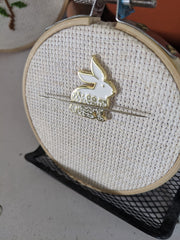 Golden Rabbit Needle Minder shown with embroidery hoop