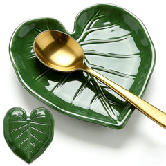 Green ceramic spoon rest on stove top