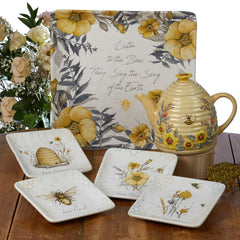3-D beehive teapot design showing bee and floral accents