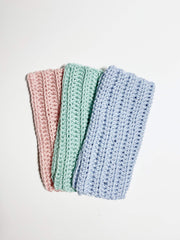 Close up mint colored handmade crochet washcloths 3-pack