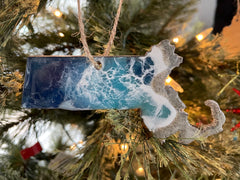 Back of ornament shows natural wood with minor discoloration