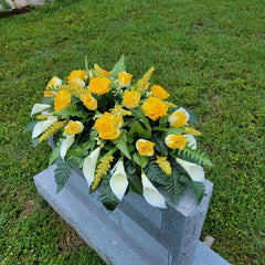 Headstone saddle featuring calla lilies and silk flowers