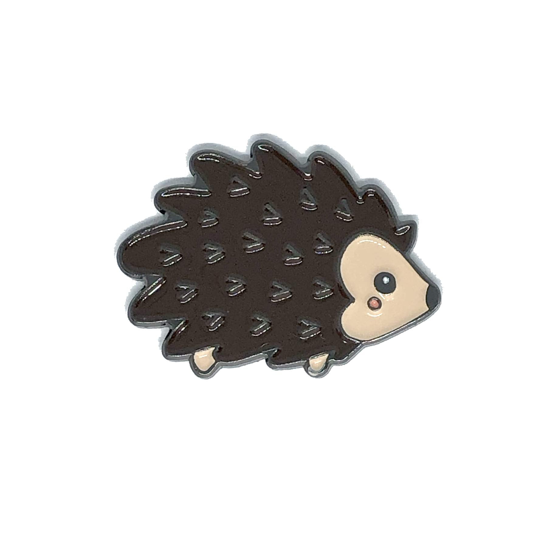 Hedgehog enamel needle minder on fabric ready for stitching
