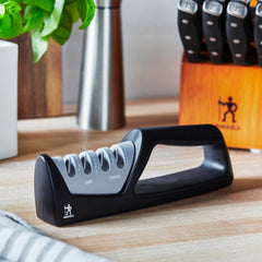 Compact handheld sharpener by Henckels for home kitchen use