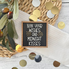 Holiday shelf accent with gold fireworks on black background
