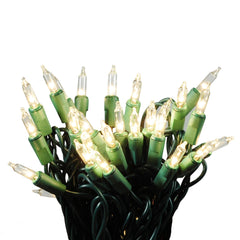 Clear Christmas light set on green wire with 3 inch spacing