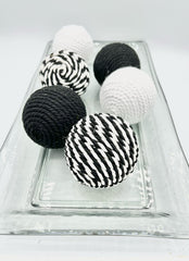 Home table decor featuring rope wrapped balls in bowls