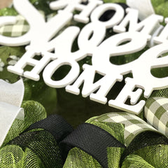 Indoor outdoor wreath with shelter from elements to stay pristine