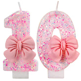IQMLQV pink 10 candle size 1.8in by 3in on cake