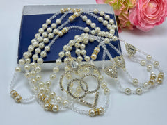 Ivory pearls and crystal lasso with 14kt gold plated heart center