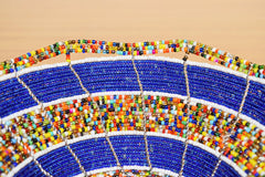Fair trade beaded bowl displayed on table