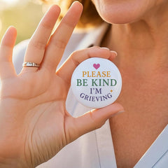 Pink heart and small star accent on the badge design