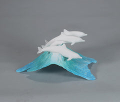 Three adult dolphins and one calf on a blue wave base (Dolphin Pod Sculpture)