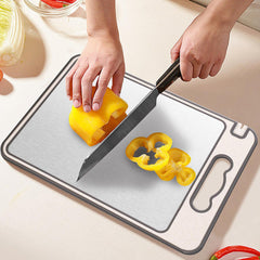 Cutting board with juice grooves for liquids