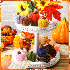 Mini knit pumpkins arranged as fall bowl fillers