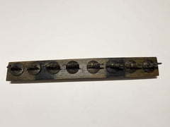 Lightly sanded stave with polyurethane finish on display