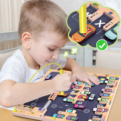 Magnetic pen attached by string used to guide blocks in the maze