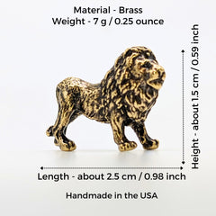 Miniature brass lion sculpture on display shelf