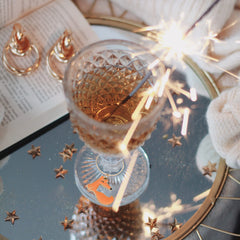 Little Prince fox and rose charm on wine glass stem close up