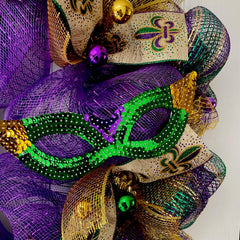 Mardi Gras front door wreath displayed on entryway