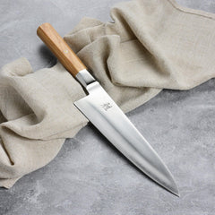 Faceted birchwood pakkawood handle on Miyabi Koya knife