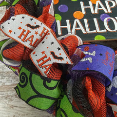 Removable Happy Halloween sign at wreath center
