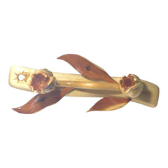 Two-tone burgundy and natural wood finish detail on bird and petals