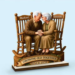 Old couple rocking chairs wooden plaque displayed on shelf