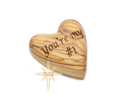 Olive wood heart measuring 2in by 1.57in by 0.8in