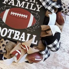 Outdoor front door wreath made of burlap with football ribbons