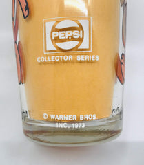 Clear Pepsi glass from the Pepsi Collector Series showing Cool Cat 1973 and Warner Bros Inc printed on both sides