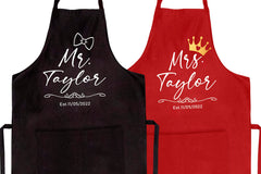 Two personalized aprons for him and her with matching design