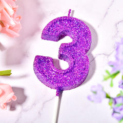 3 number cake candle with holder on cake