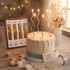 Gold spiral long thin metallic candles with holder on cake
