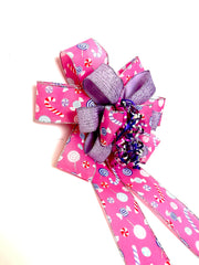 Candy motif ribbons on Pink Whimsy Candy Bow for wreath