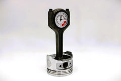 Piston clock with RPM dash inspired face for car enthusiasts