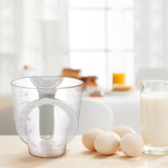 Assorted color plastic measuring cup with clear markings