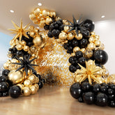 PTGOLUO Balloon Arch Garland Kit with black and gold balloons and stars