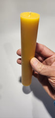Pillar candle with natural beeswax color and cotton wick