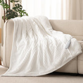 Reaks electric heated throw blanket white 50x60 on bed