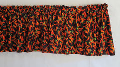 Red chili pepper motif across valance fabric