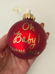 Includes ivory hanging ribbon on red glass ornament